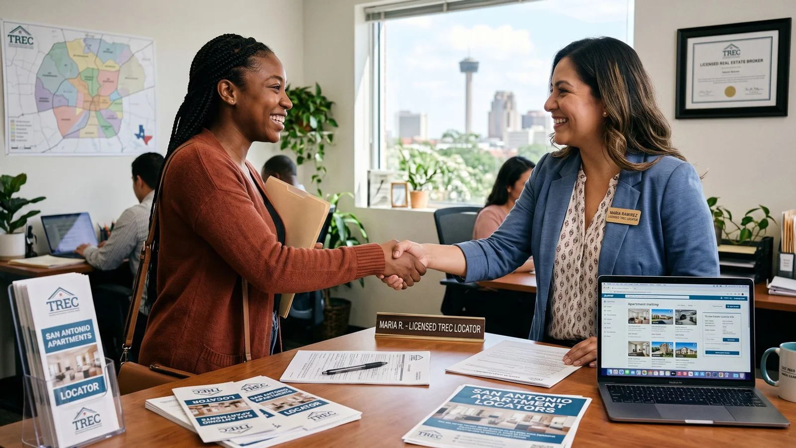 Renter shaking hands with a licensed San Antonio locator at the office